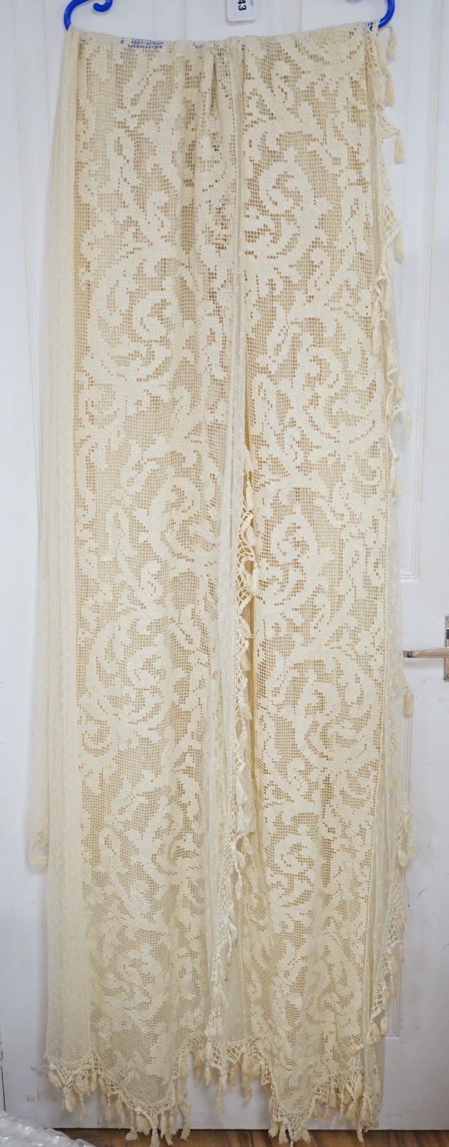 A pair of Edwardian fine net curtains bordered with wide fillet lace, edged with tasselled bobbin lace 272 x 155cm